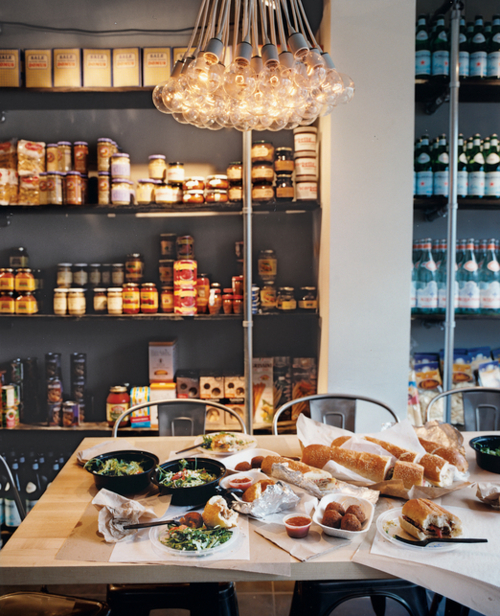 kitchen with deli food on table