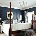 bedroom the dark wood, navy blue walls, with all the white